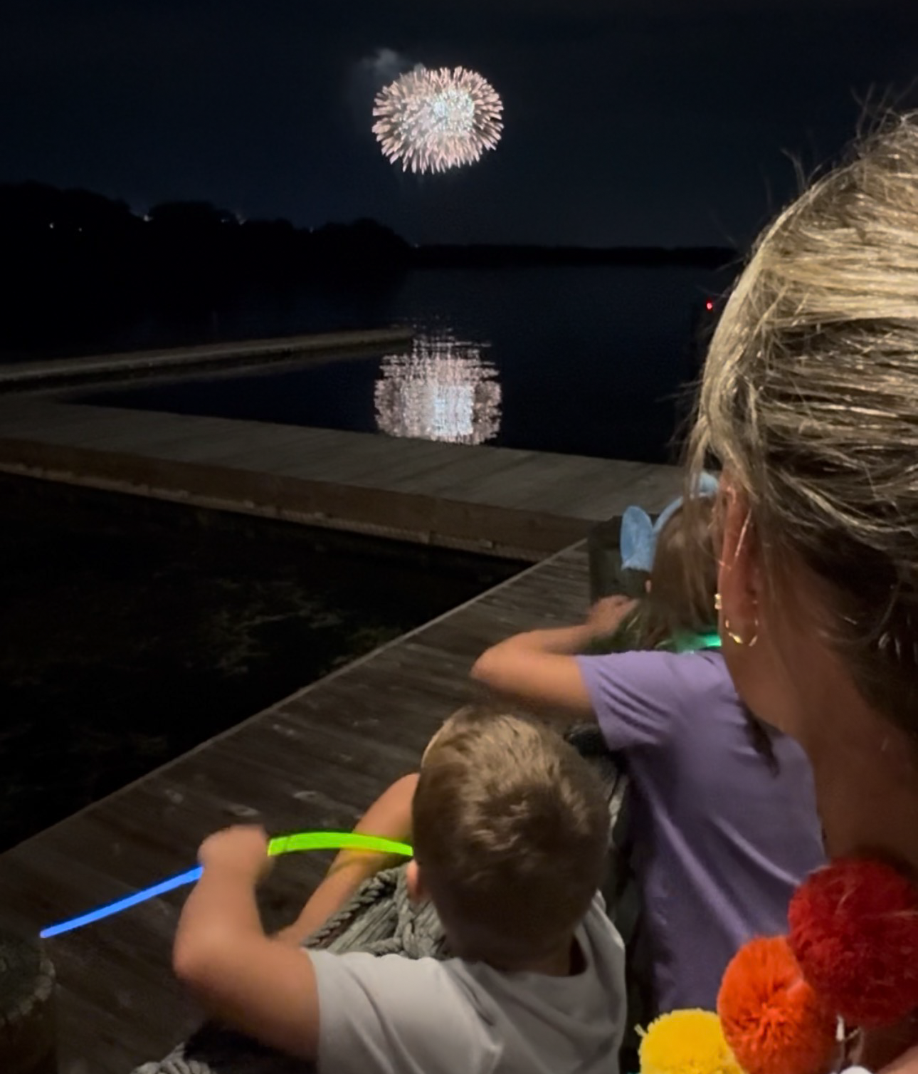 Magic Kingdom fireworks viewed from the Fort Wilderness pier over the lake